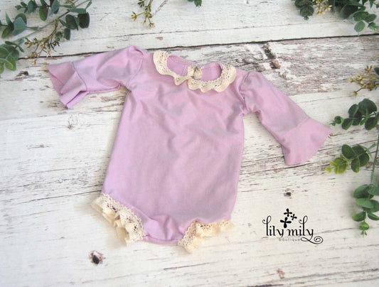 Newborn Violet Romper, Flutter Sleeves, and trimmed in crochet lace.