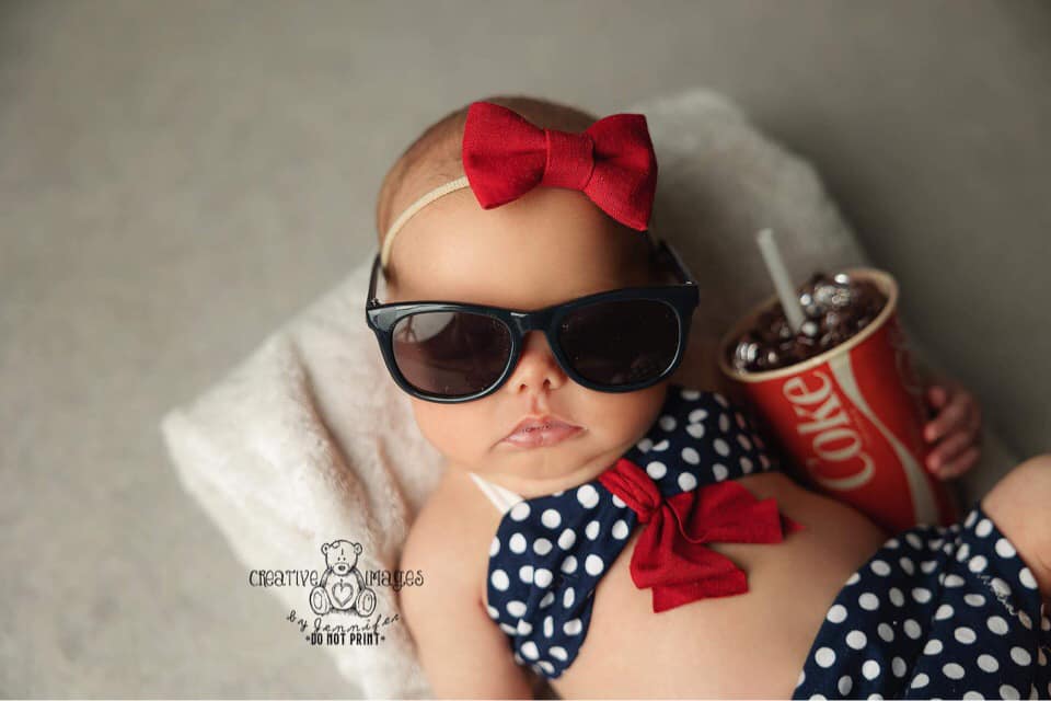 Newborn blue and white polka dot bikini.