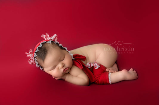 Newborn Bonnet, Holiday red and white gingham bows on red with ruffled lace.