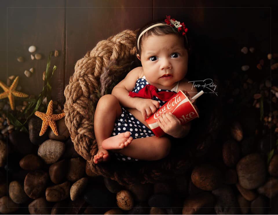 Newborn blue and white polka dot bikini.
