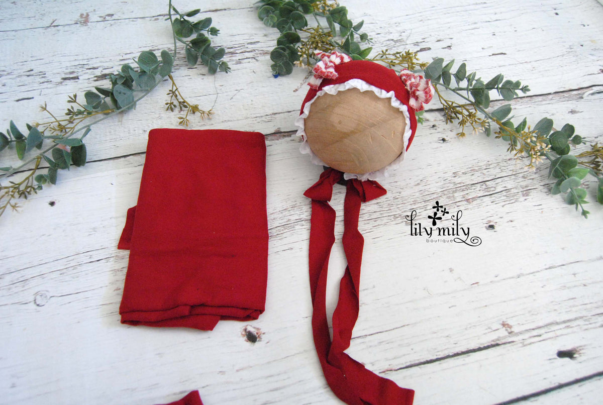 Newborn Bonnet, Holiday red and white gingham bows on red with ruffled lace.