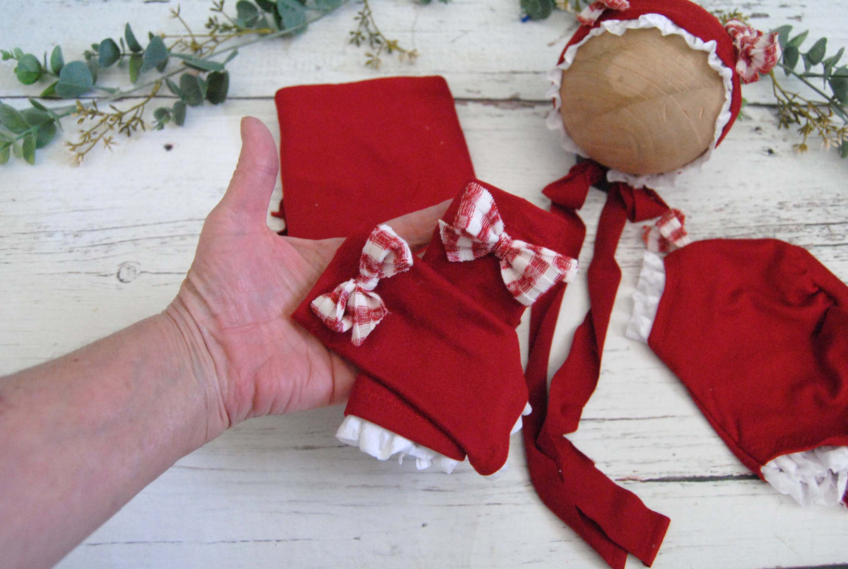 Newborn Bonnet, Holiday red and white gingham bows on red with ruffled lace.