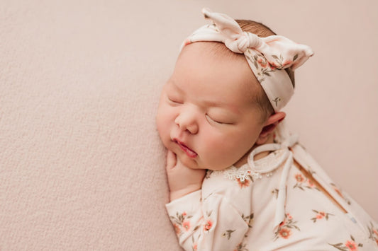 Newborn footed floral romper and knotted headband