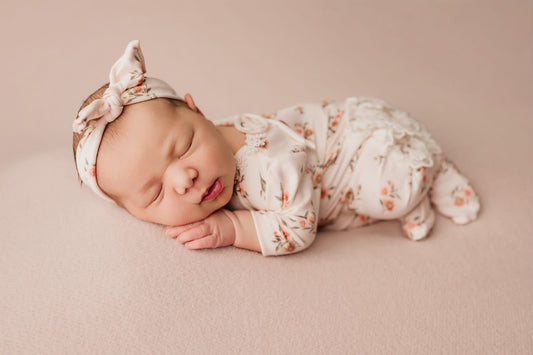 Newborn footed floral romper and knotted headband