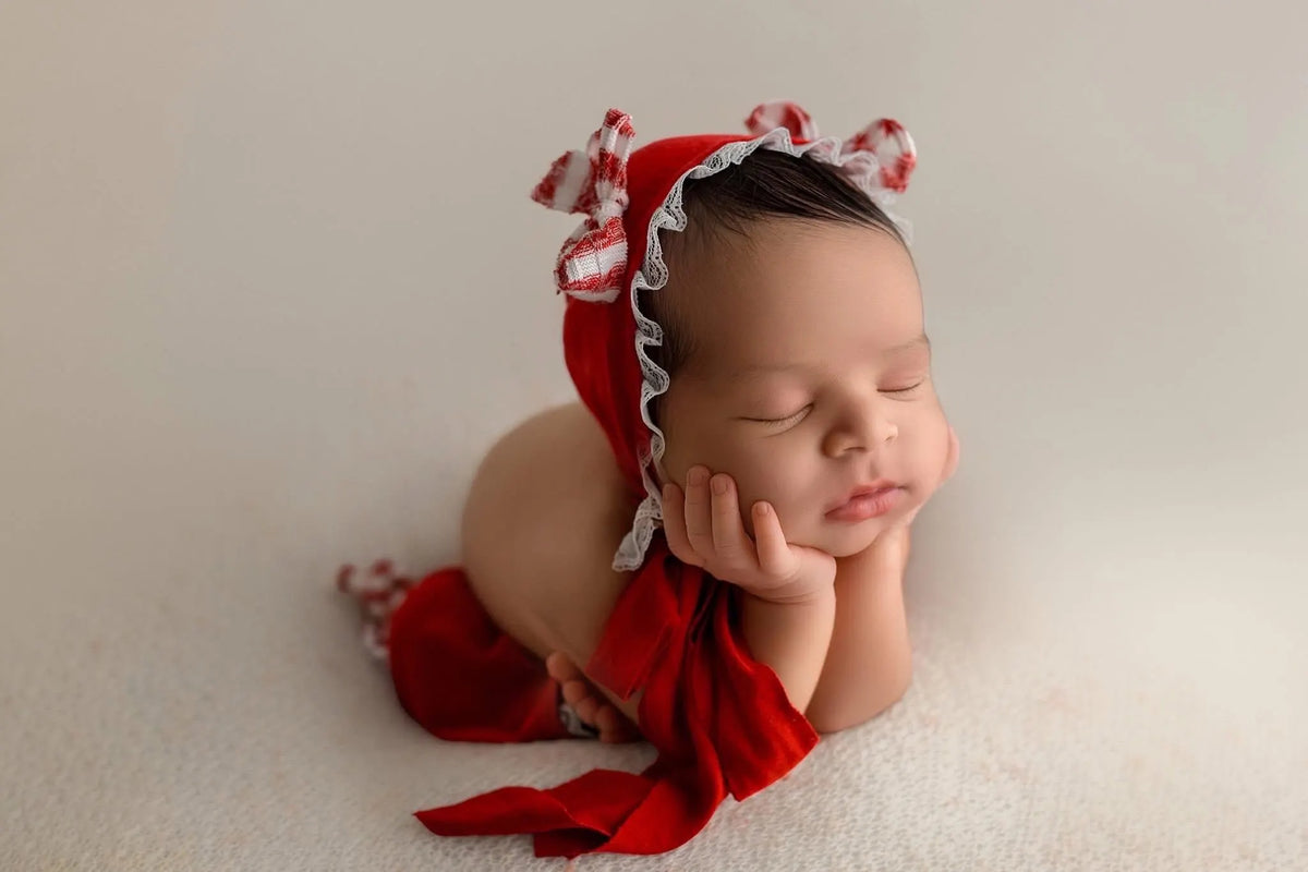 Newborn Bonnet, Holiday red and white gingham bows on red with ruffled lace.